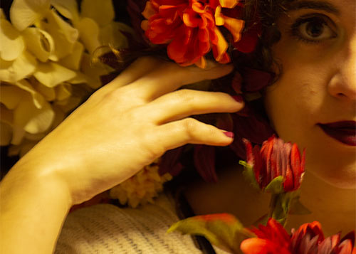 color photo of a woman with flowers